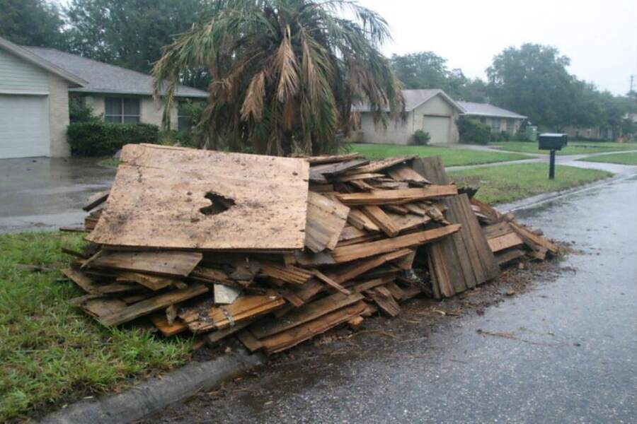A pile of splintered lumber and debris left by a hurricane